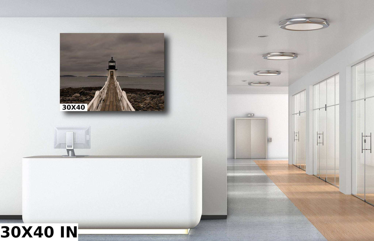 Marshall Point Lighthouse Print showing a rocky New England shoreline and wooden walkway leading to the lighthouse beneath a cloudy gray sky