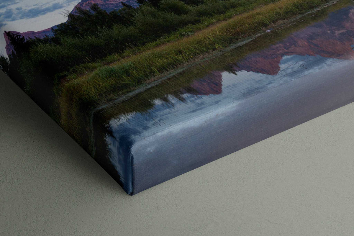 Grand Teton Sunrise Print canvas featuring blue mountain reflections, green shoreline grasses, and a wrapped edge