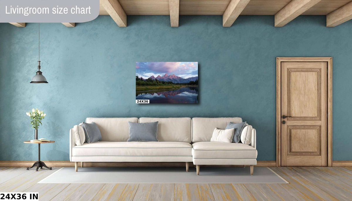 Grand Teton Sunrise Print featuring a mountain range in pink dawn light reflected in a calm lake, with evergreen forest