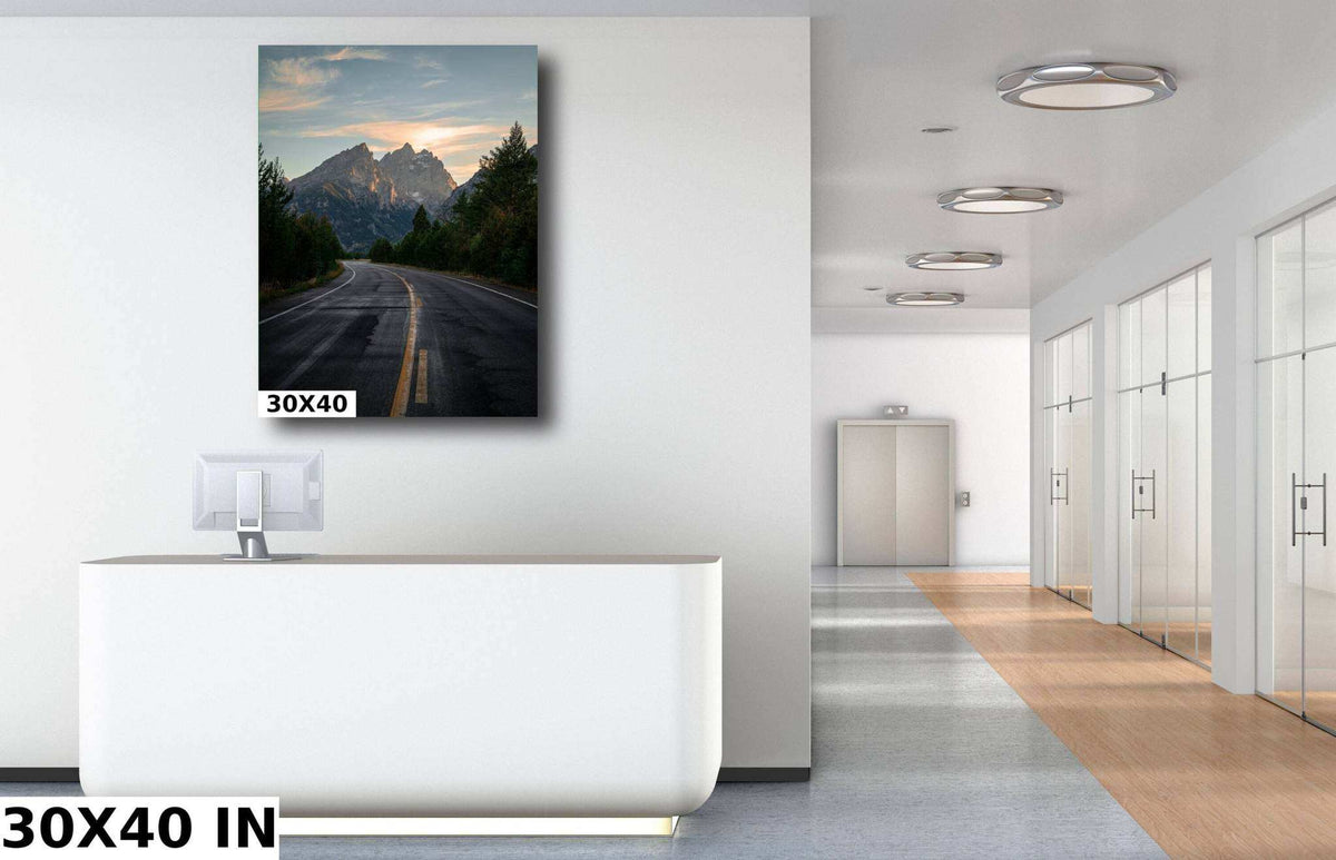 Grand Teton Wall Art featuring a color mountain landscape print with a winding paved road beneath rugged peaks