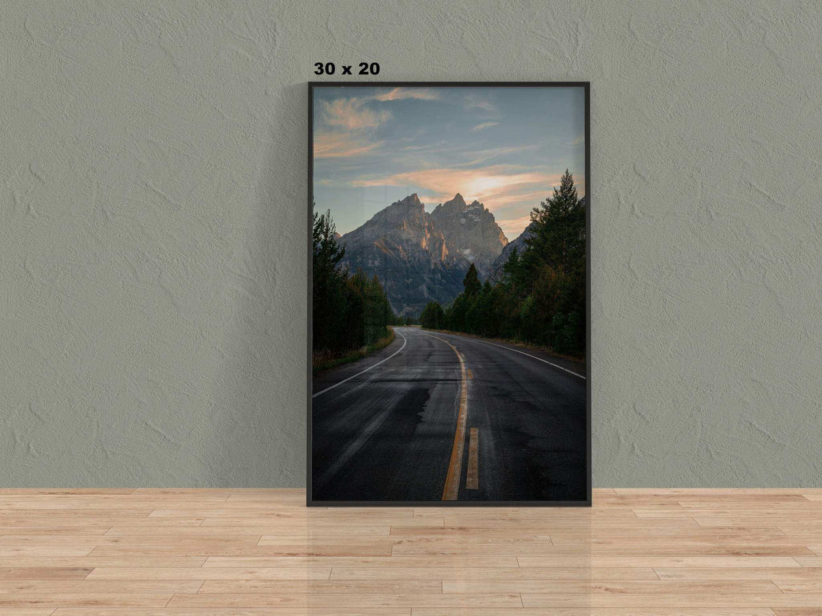 Grand Teton Wall Art featuring a framed mountain landscape photograph with a winding road, forest, and dramatic peaks