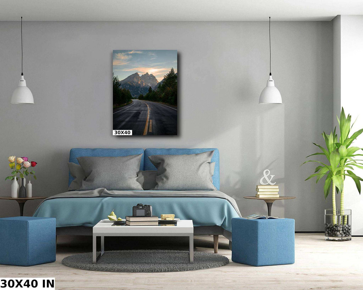 Grand Teton Wall Art featuring a mountain road beneath rugged peaks, with dark green trees and a pastel sunset sky