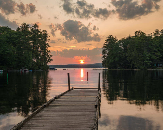 Great East Lake Dock Sunset Print showing a wooden dock over calm water, evergreen shoreline, and orange sunset sky