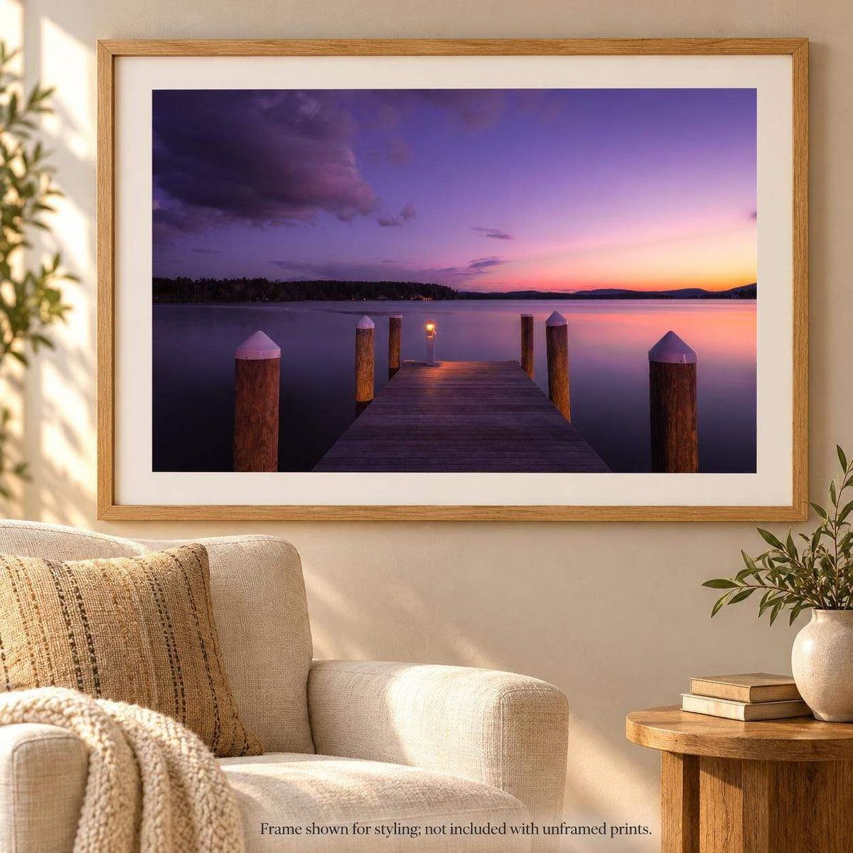 Lake Winnipesaukee Sunset Photography print showing a wooden dock and posts on calm water beneath a purple-pink sunset