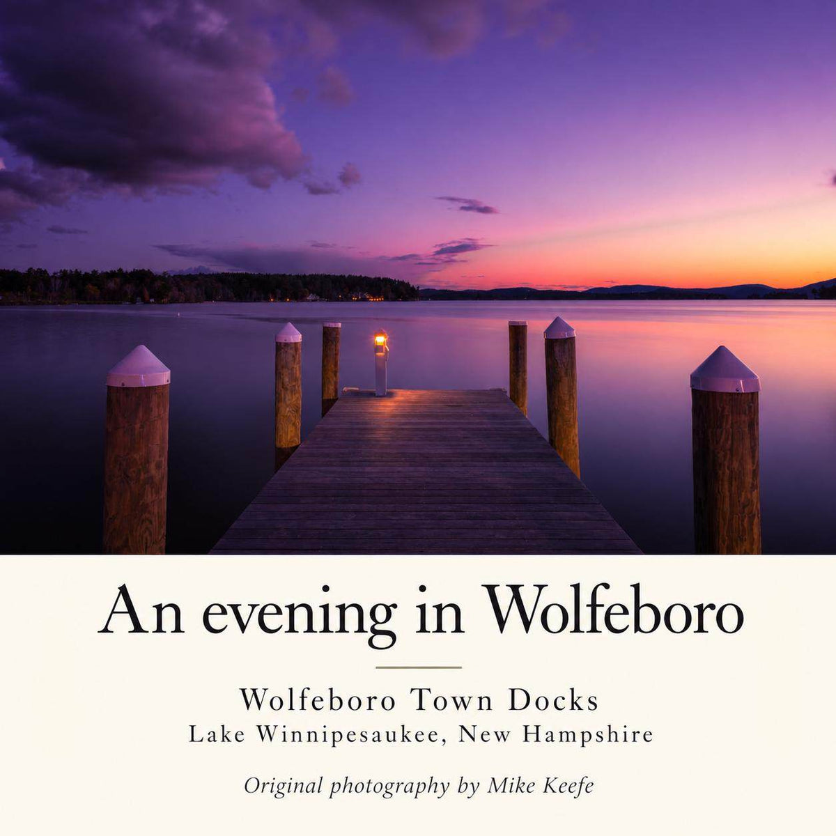 Lake Winnipesaukee Sunset Photography print showing a wooden dock with lit lamp, calm water, and a purple-pink sky