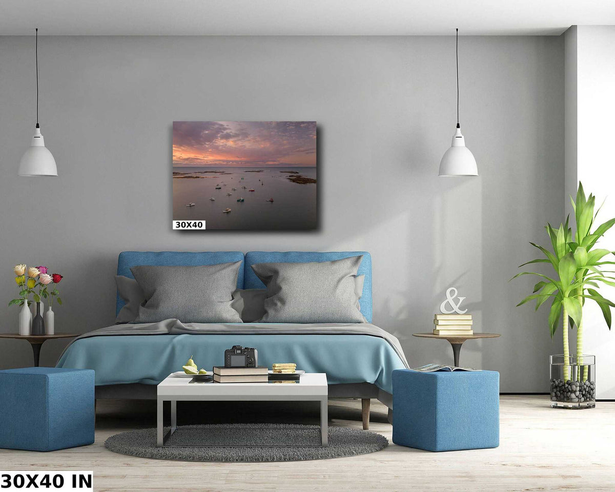 Maine Coastal Wall Art showing a coastal harbor at sunset, with silhouetted boats on calm water beneath a pink-orange sky