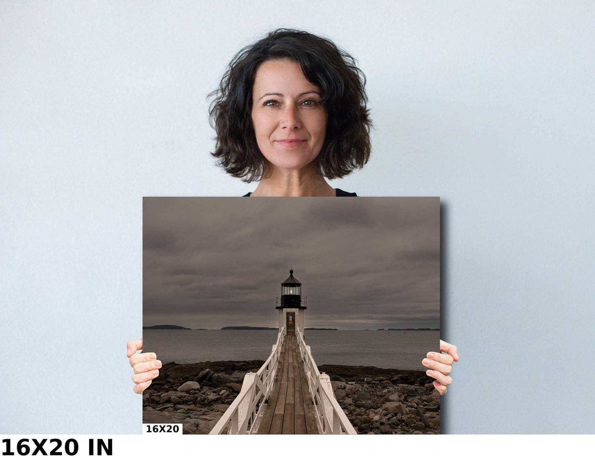 Marshall Point Lighthouse Print, fine-art photograph of a white lighthouse on a wooden walkway beneath a cloudy gray sky