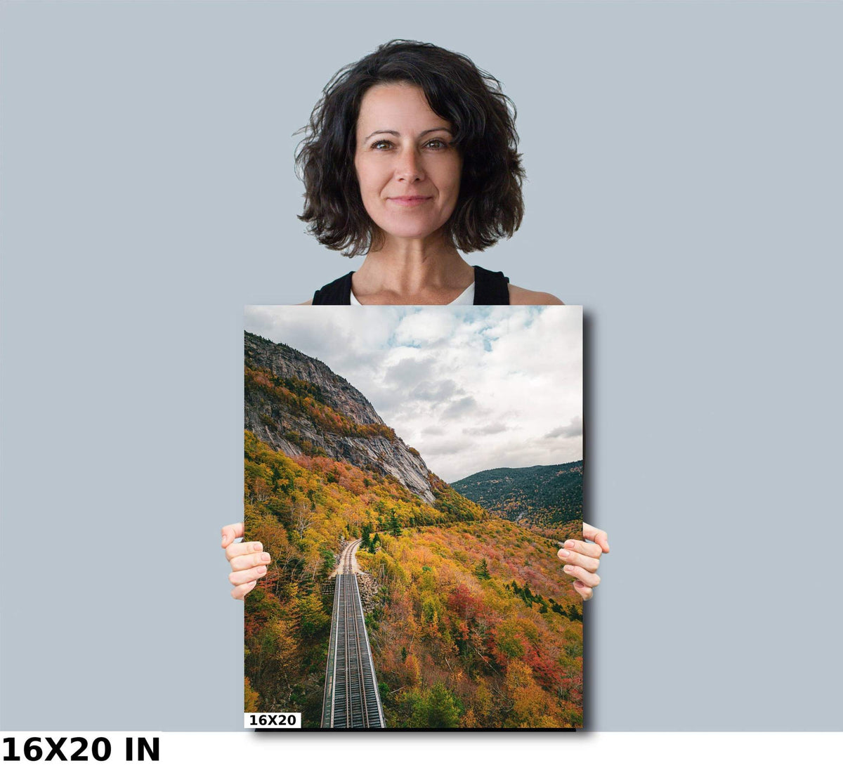 New Hampshire Fall Foliage Print showing a railroad through vibrant autumn-colored mountain forest beneath a cloudy sky