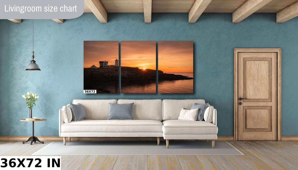 Nubble Lighthouse Print, three-panel coastal wall artwork in warm orange sunset tones, showing a lighthouse on a rocky shore
