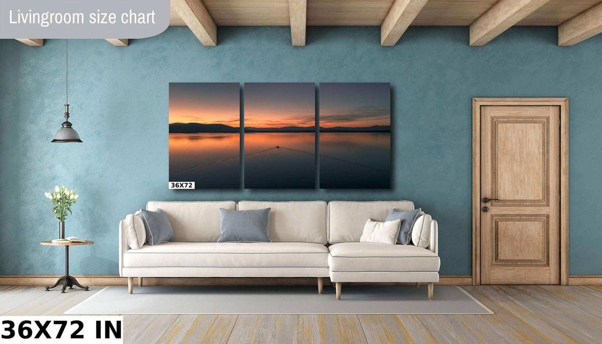 Ossipee Lake Wall Art in three dark panels, showing a calm lake, silhouetted hills and vivid orange sunset sky