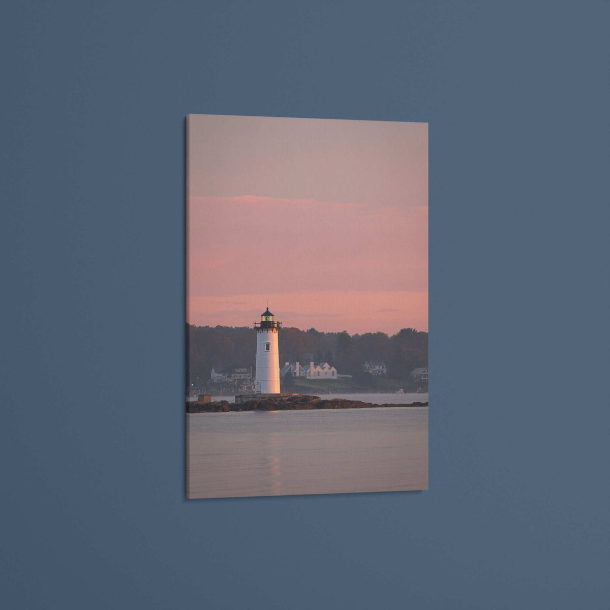 Portsmouth Harbor Lighthouse Art print showing a white lighthouse on a rocky shoreline beneath a pink sunrise sky