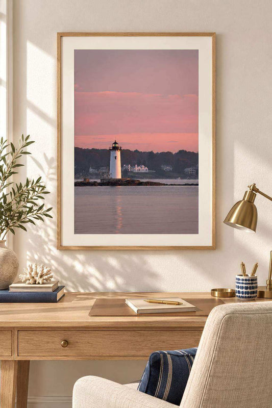 Portsmouth Harbor Lighthouse Art shows a white lighthouse against a pink sunrise sky, calm water, and dark shoreline.