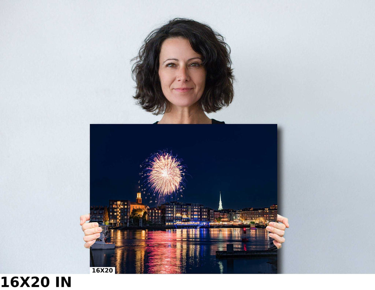 Portsmouth NH Fireworks Print showing a bright pink-and-gold burst above a lit harborfront, reflected on dark water