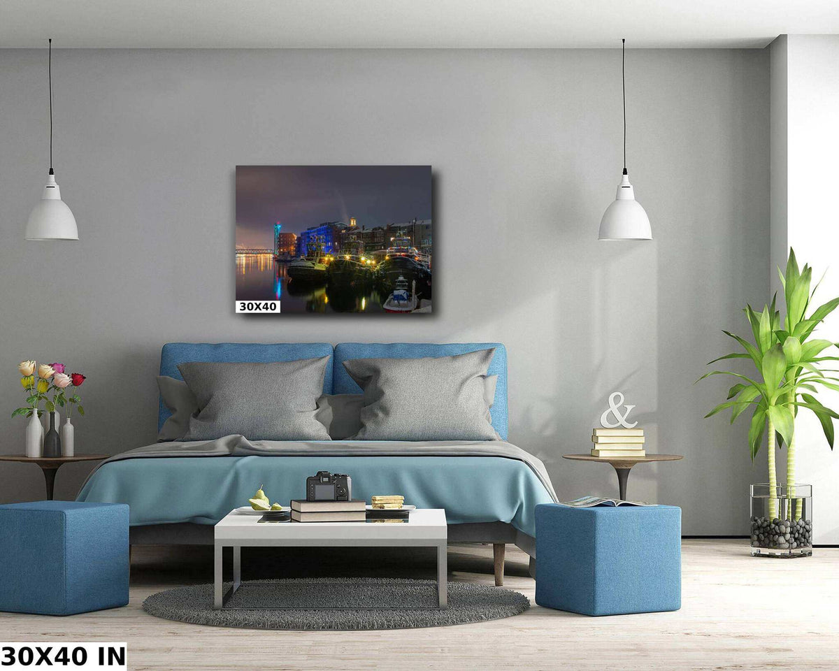 Portsmouth NH Wall Art featuring a colorful nighttime harbor with illuminated waterfront buildings and boats reflected in dark water