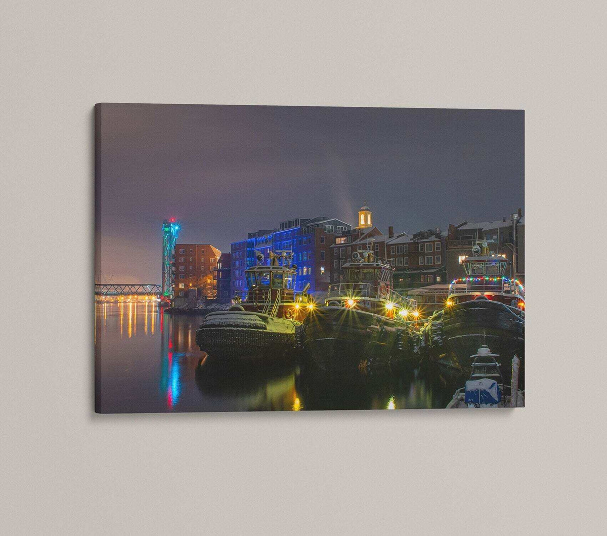 Portsmouth NH Wall Art photograph of tugboats on dark harbor water, with vivid colored lights and glowing waterfront buildings