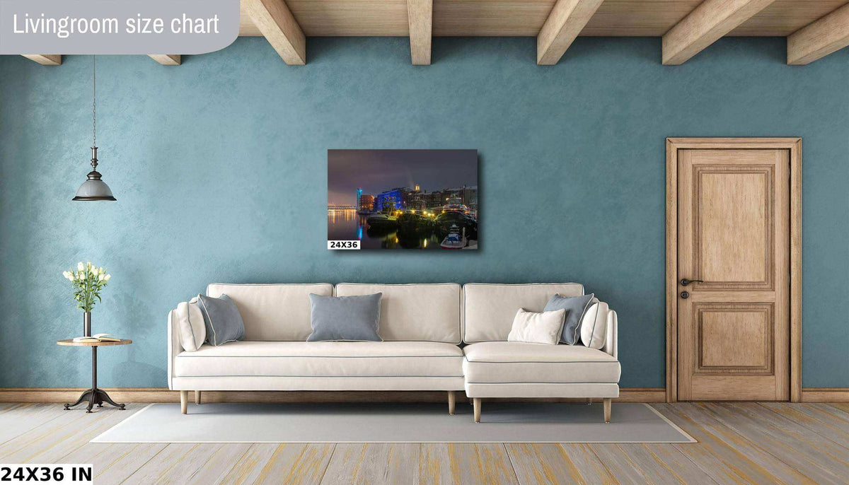 Portsmouth NH Wall Art print showing a nighttime harbor with glowing waterfront buildings and boats on dark water.