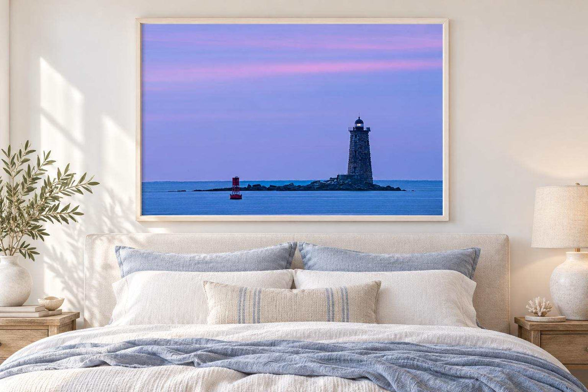 Whaleback Lighthouse Print featuring a dark stone lighthouse on blue harbor water beneath a pink and purple sky
