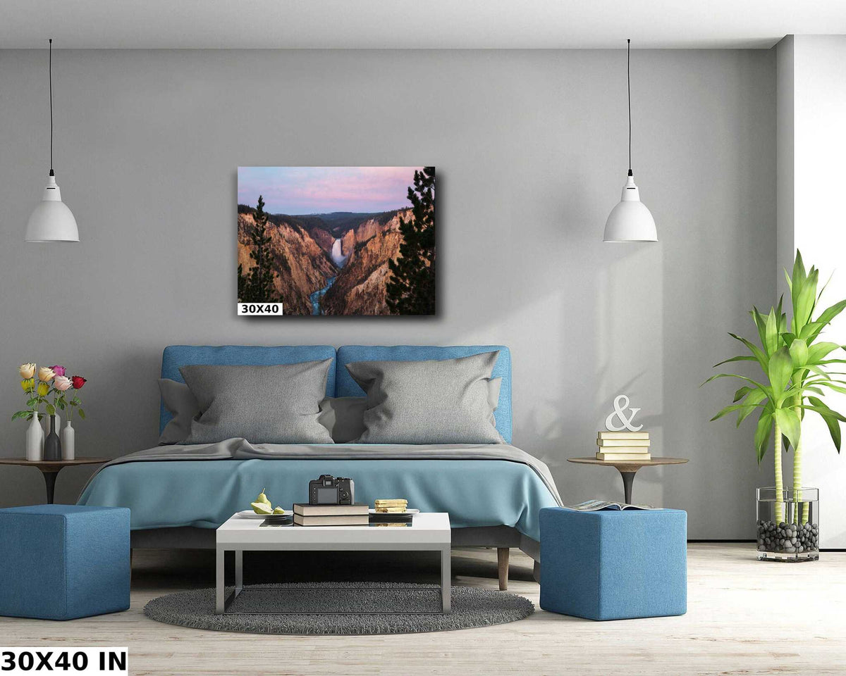 Yellowstone Lower Falls Print showing a blue waterfall between rugged canyon cliffs beneath a pink and blue sky