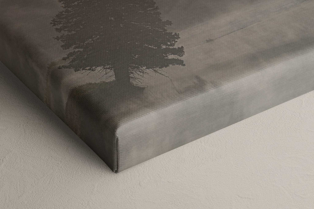Yellowstone National Park Print on a gray canvas featuring a dark silhouette of a leaning tree in soft fog